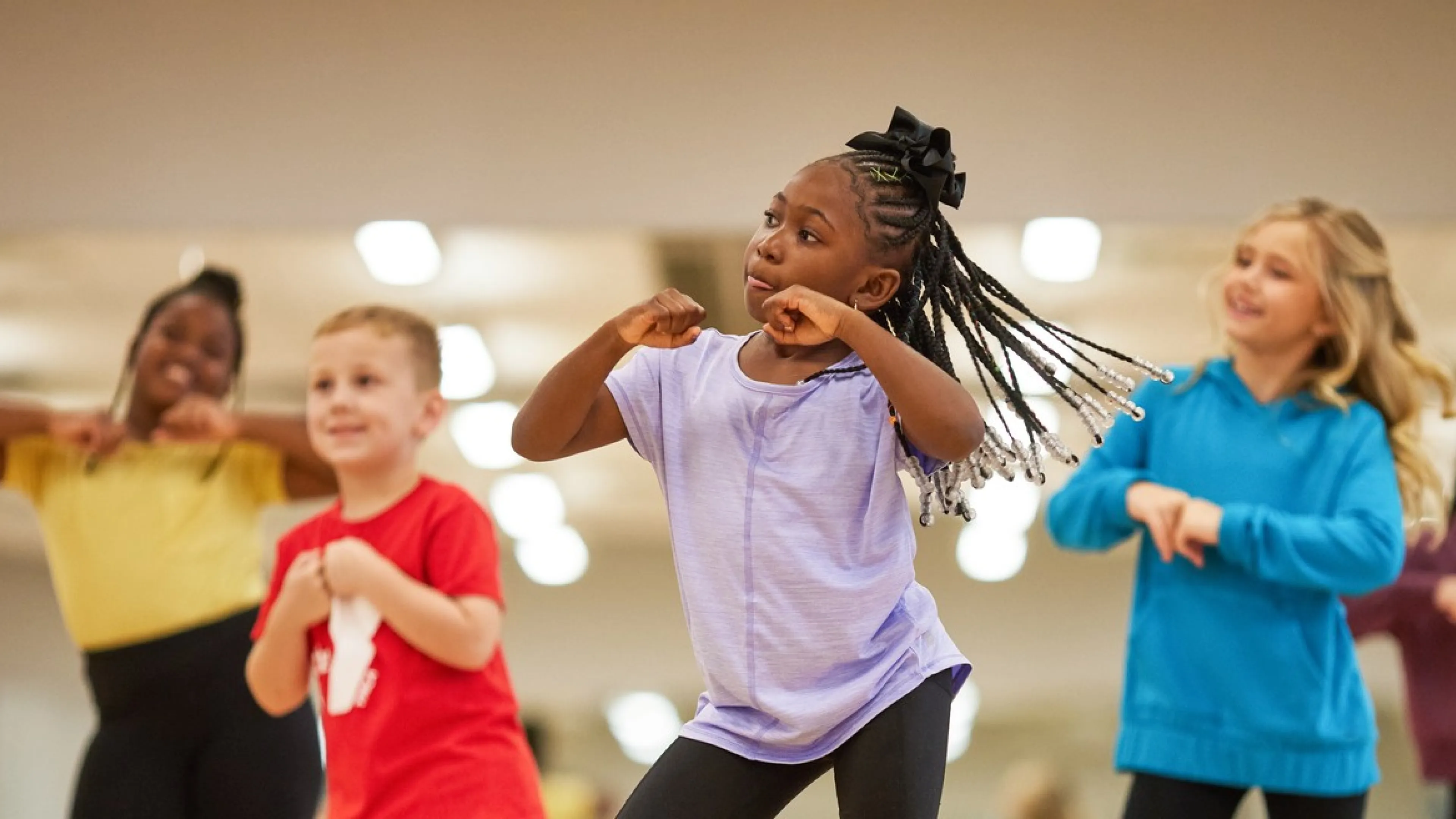 Group of 5 children dancing