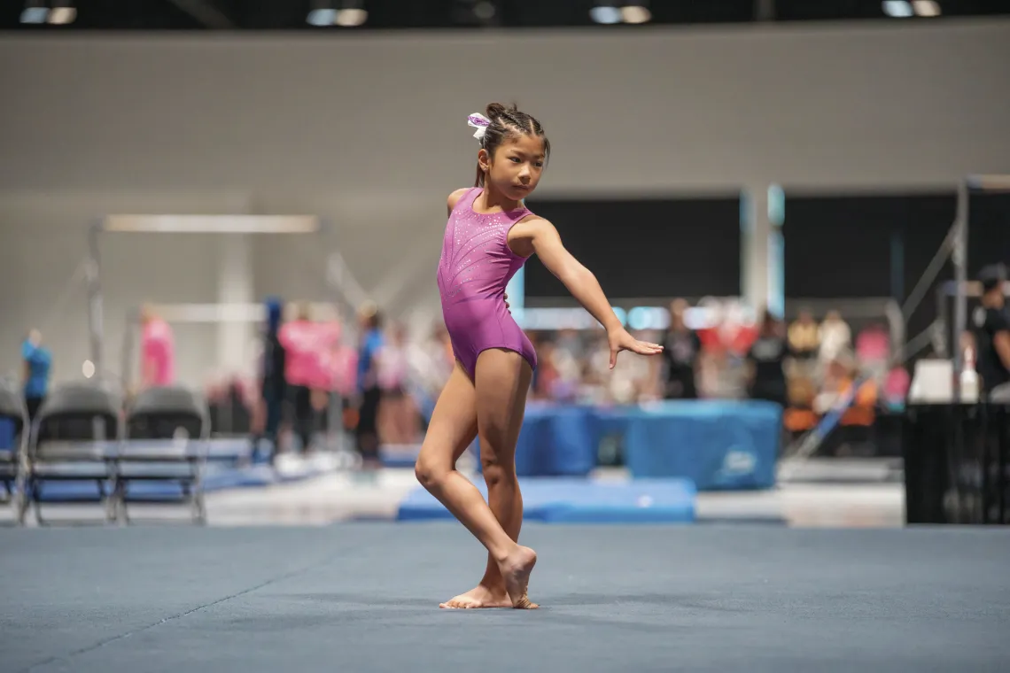 young gymnast on the mat