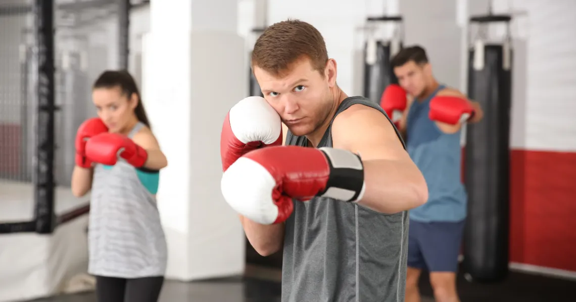 boxer leading cardio boxing class